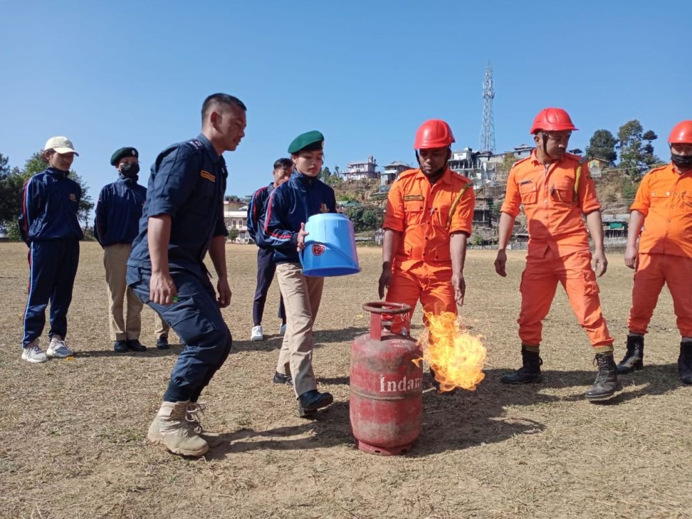 NCC cadets practice putting out a gas cylinder fire under the supervision of F&ES personnel during the CATC camp at Fazl Ali College, Mokokchung.